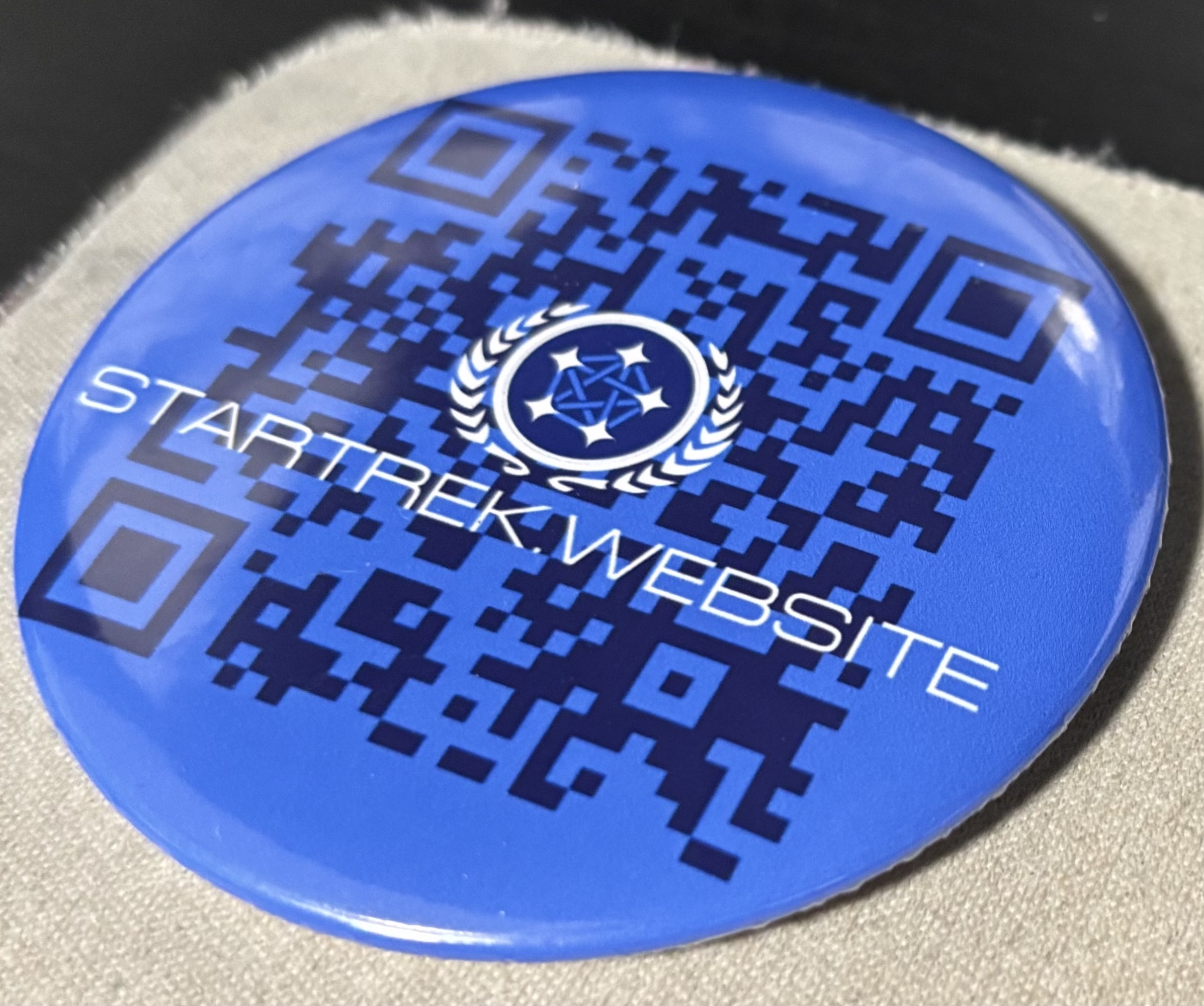 Startrek.website Button with instance logo and name in front of a QR code.