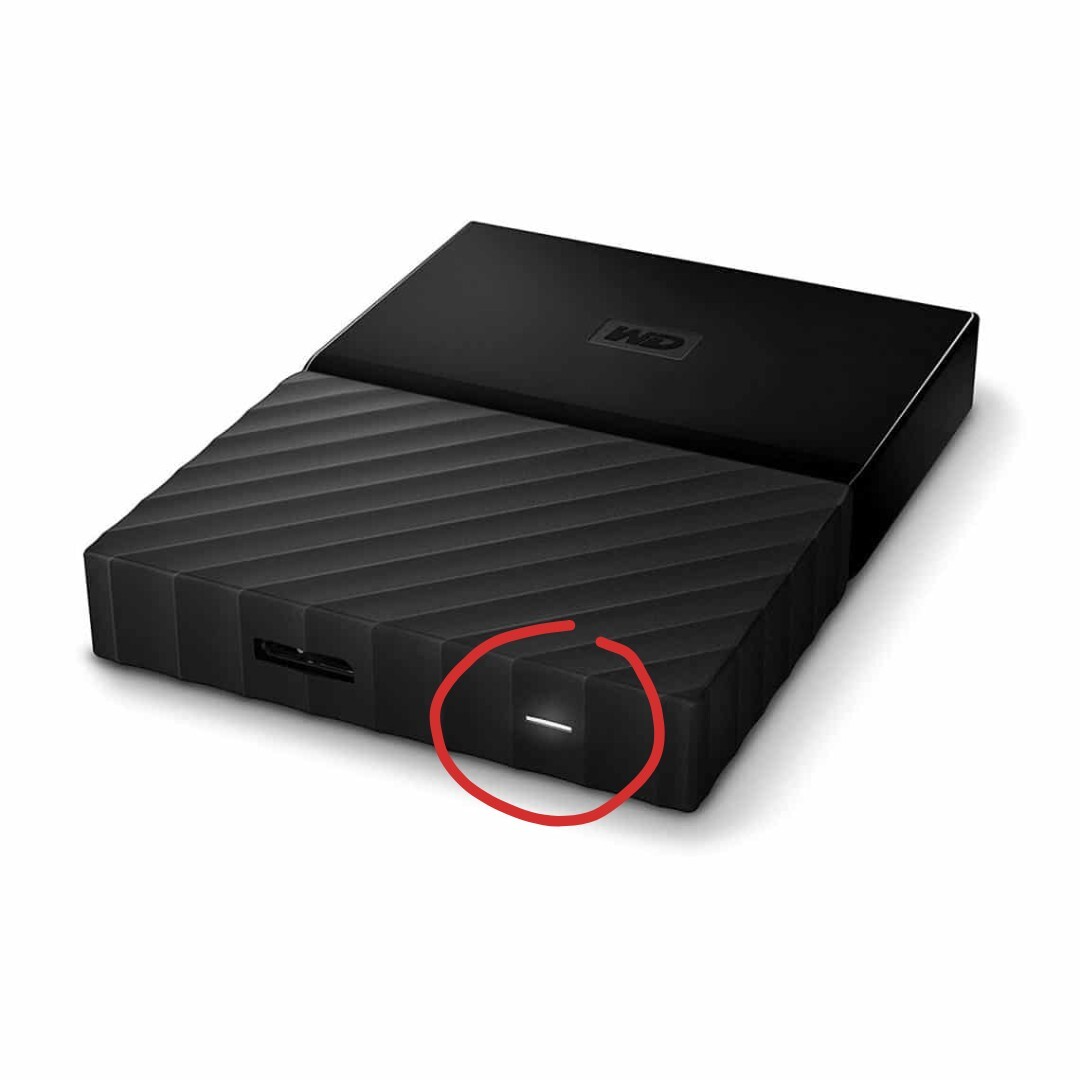 WD Hard Drive blinking light on, highlighted with red circle